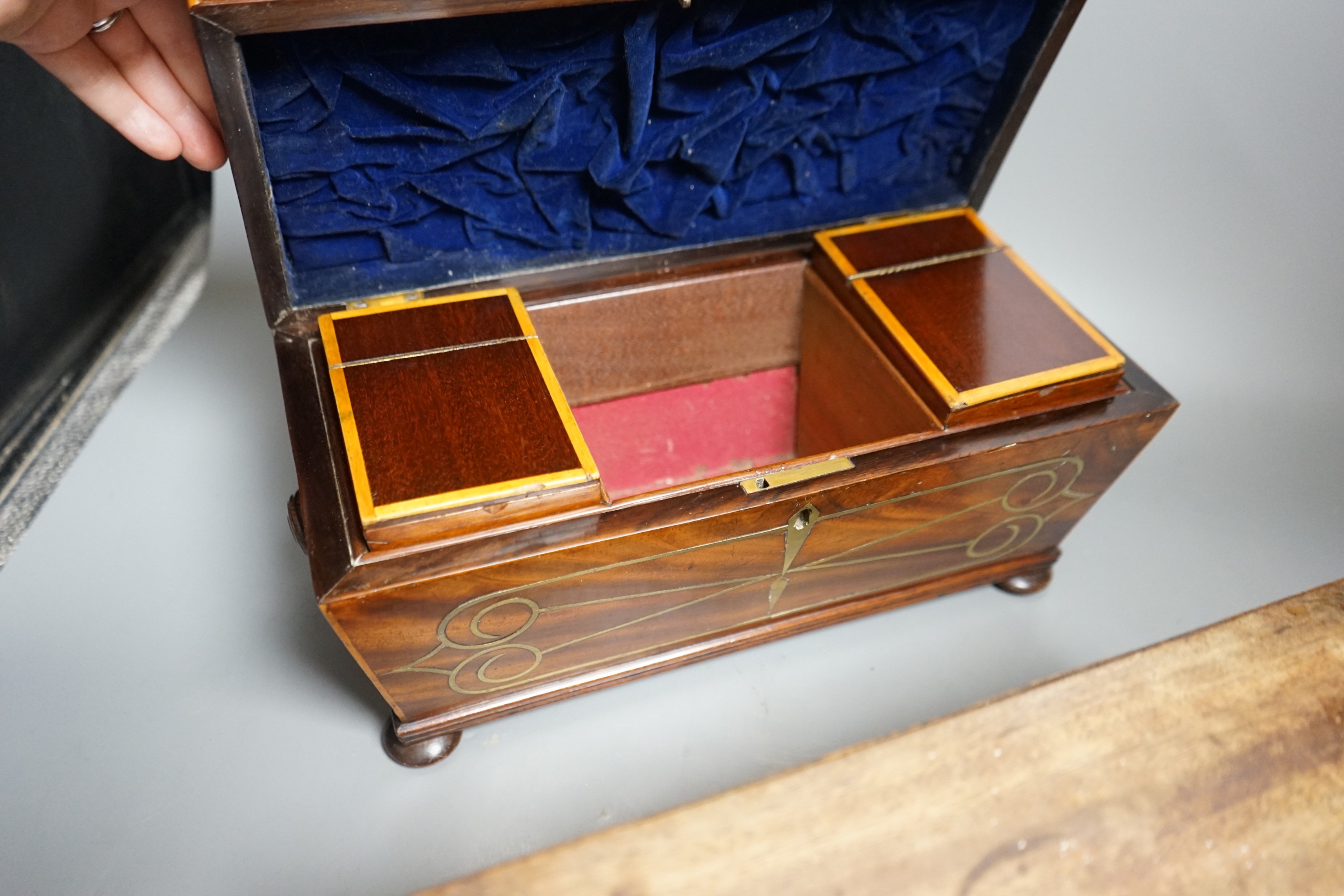 A Regency brass inlaid sarcophagus tea caddy and a George III mahogany caddy, sarcophagus caddy, 18.5cms high